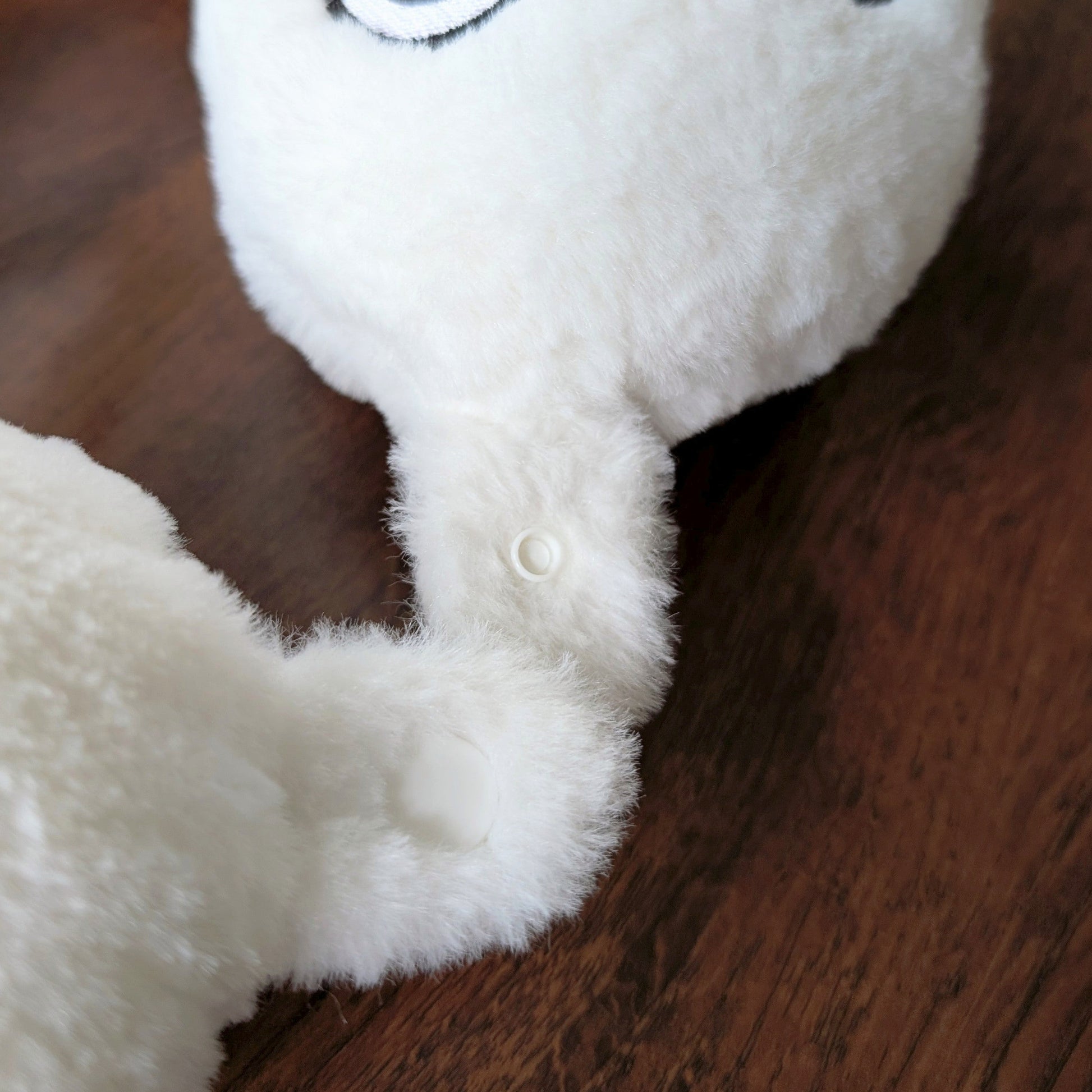 Detailed close-up of Brushbuddy neck pillow clasp and fabric material