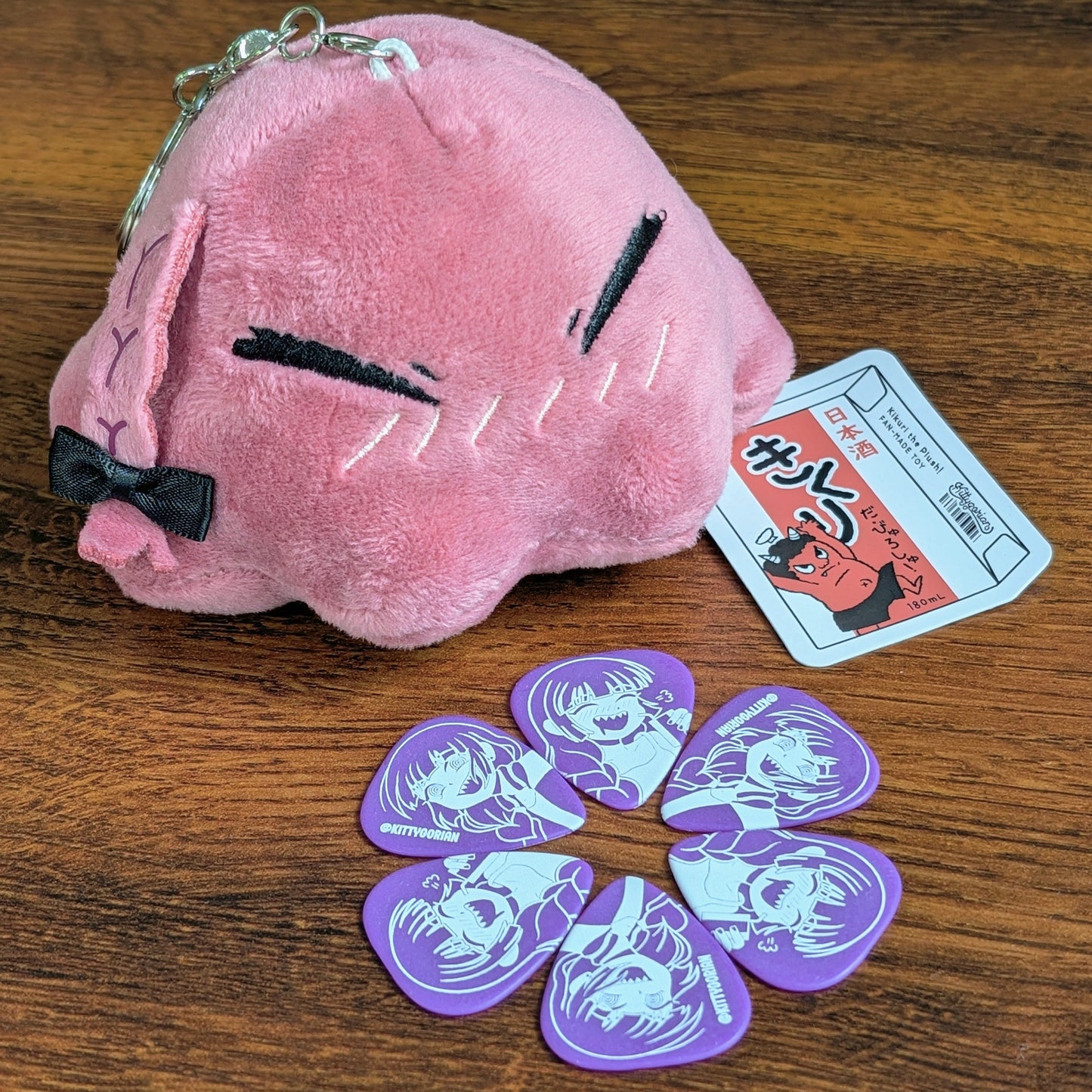 Kikuri Tako Plush with a ring of Kikuri guitar picks